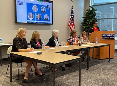 leadership panel sitting at table